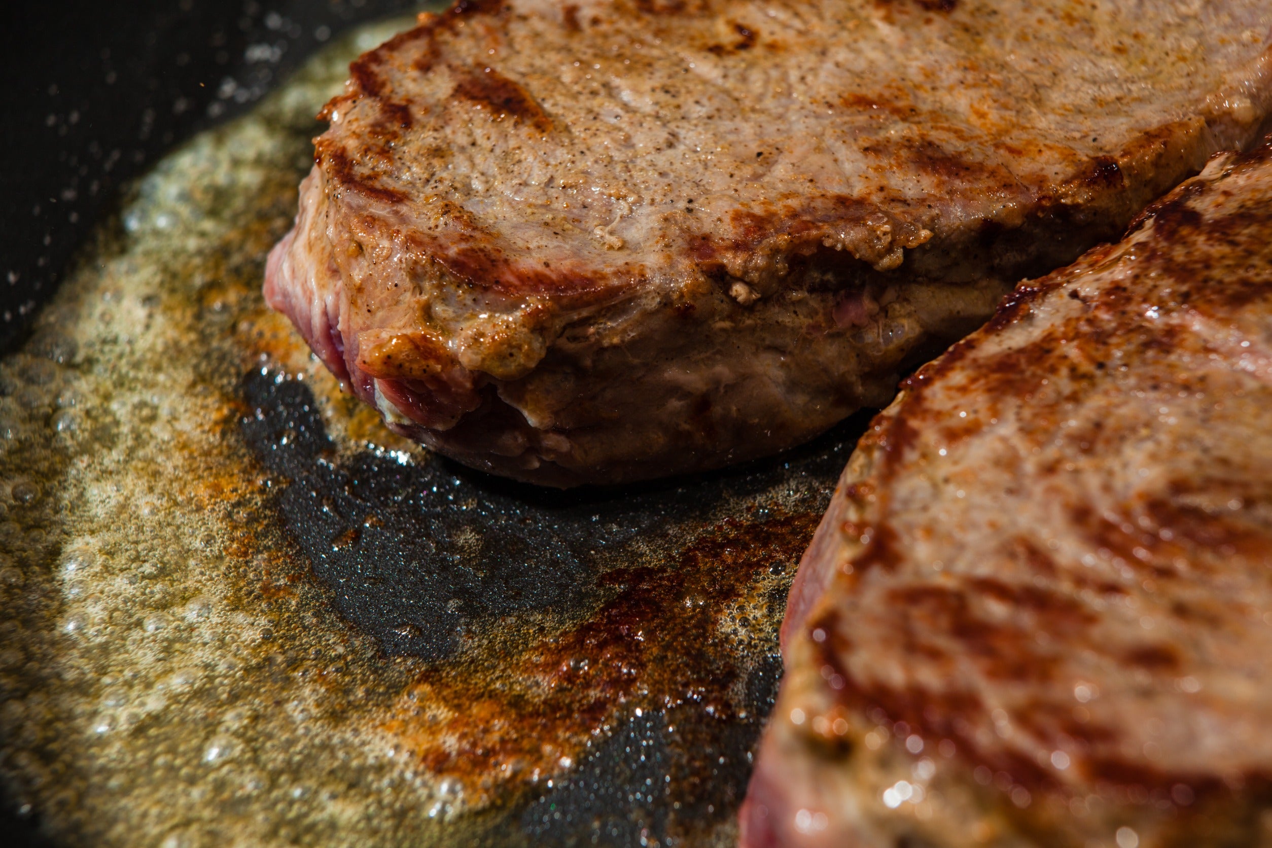 Grilled New York Strip Steaks with Herb Butter