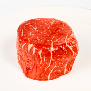 Filet mignon: Tender beef on a white plate.